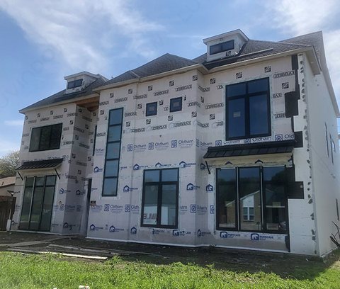 Black aluminium windows installed on a home under construction