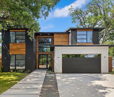 Modern home with black aluminium windows and wood cladding