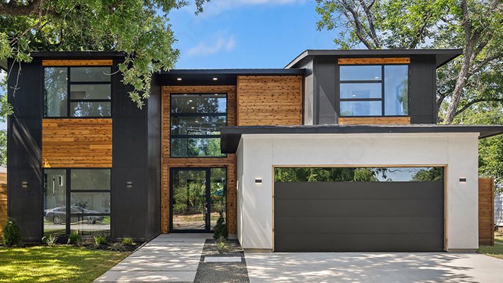Modern home with black aluminium windows and wood cladding