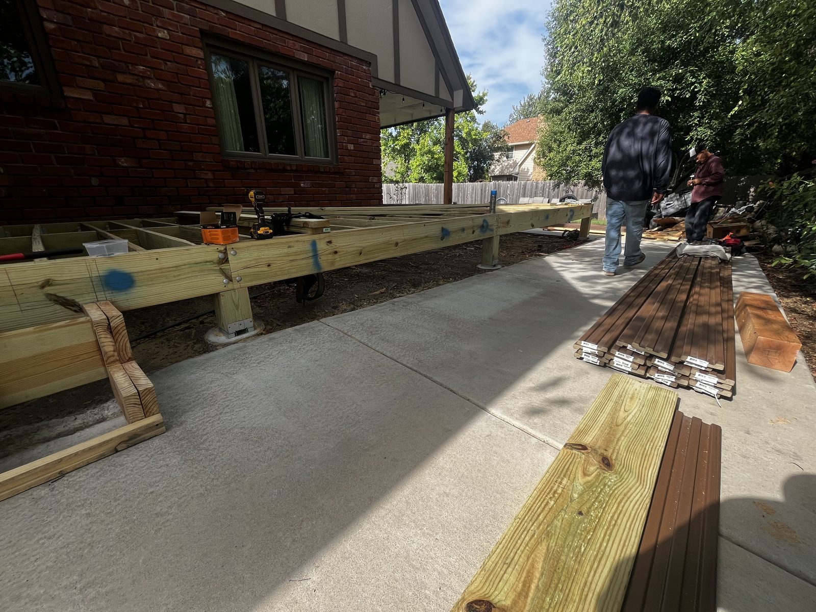 Deck framing underway with crew on site