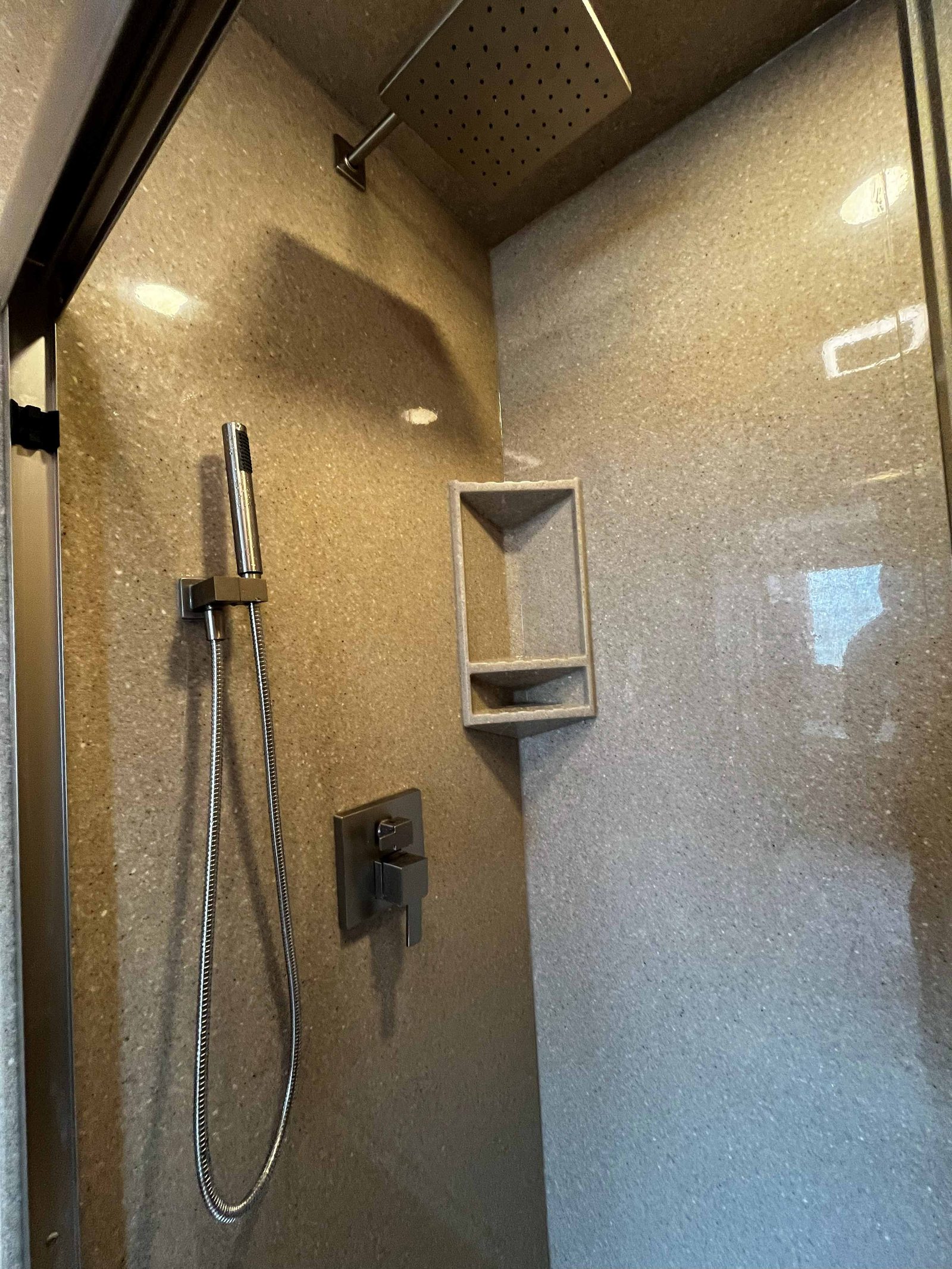 Onyx shower detail, rain head and corner shelving