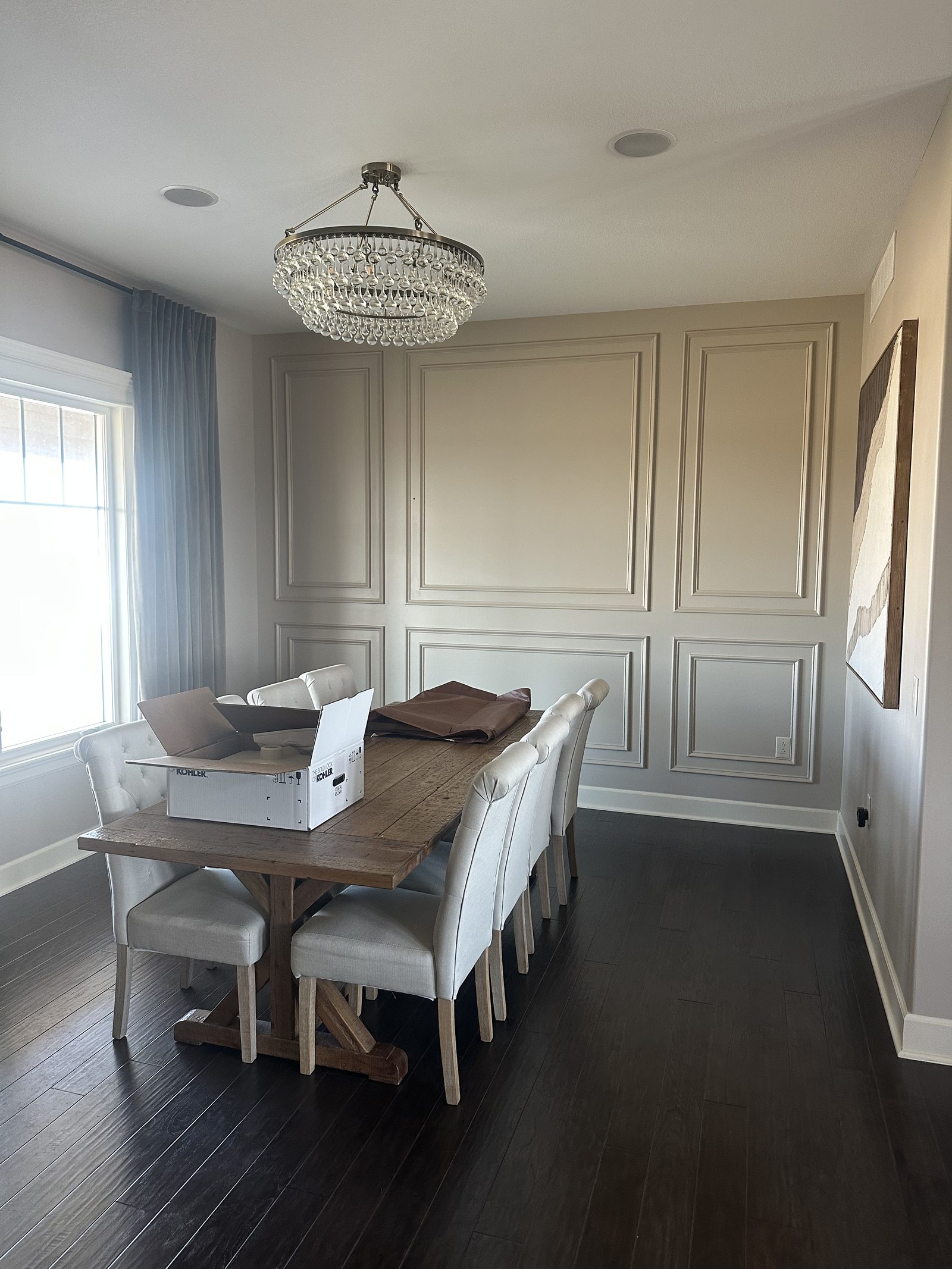 Dining area with new flooring and light fixture