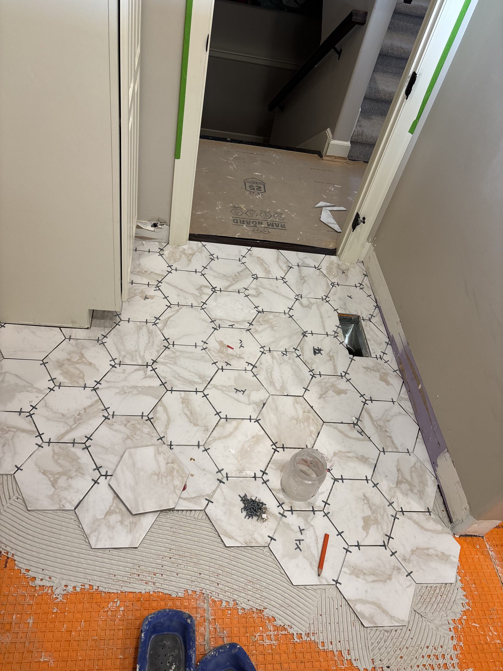 Hex tile floor being laid