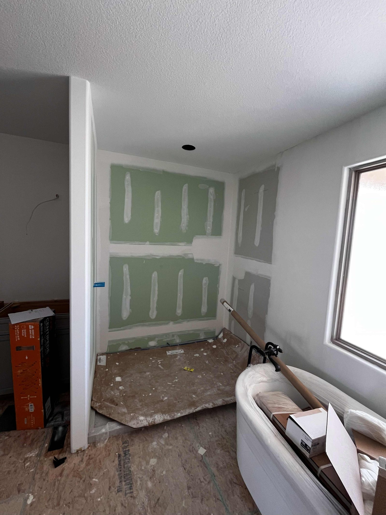 Master bath framed and boarded before Onyx install
