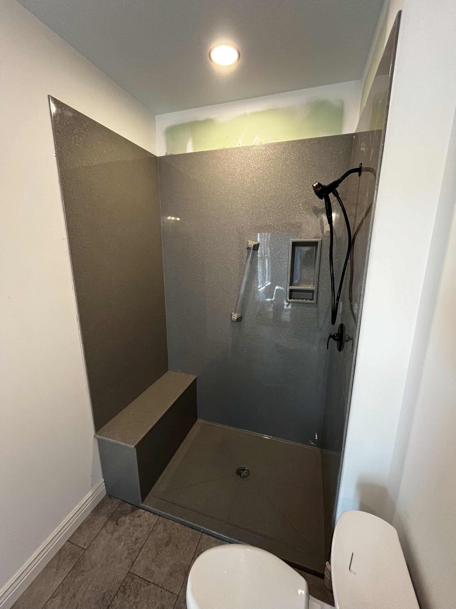 Secondary Onyx shower with bench and matte black fittings