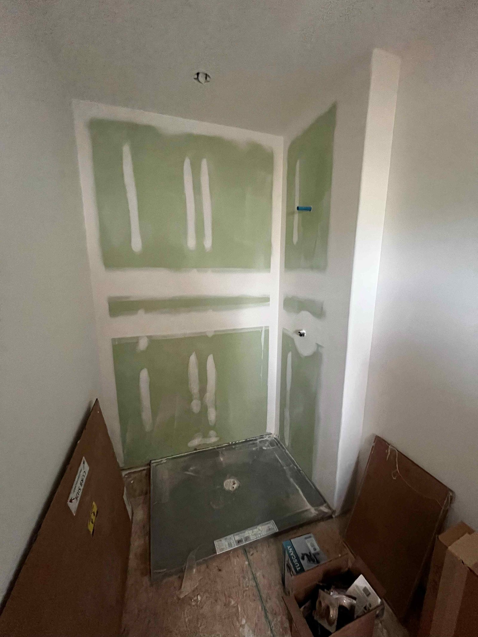 Shower pan set and walls boarded ready for Onyx