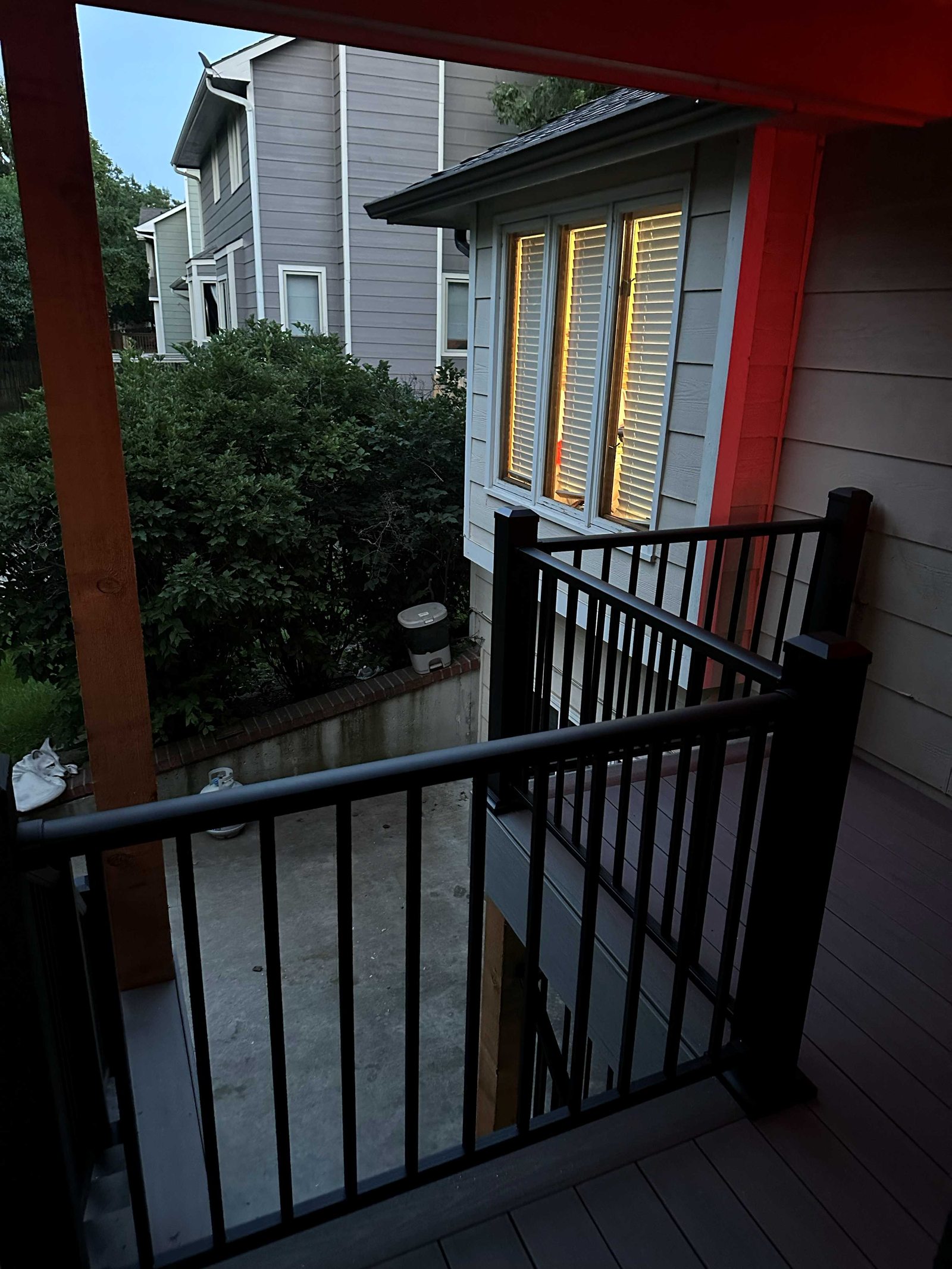 Black railing and composite decking seen from the upper deck