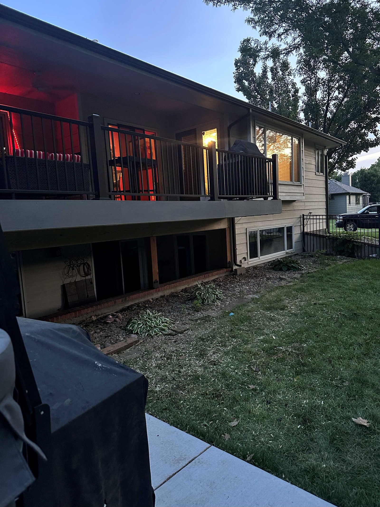 Finished deck fascia and railing along the rear of the house