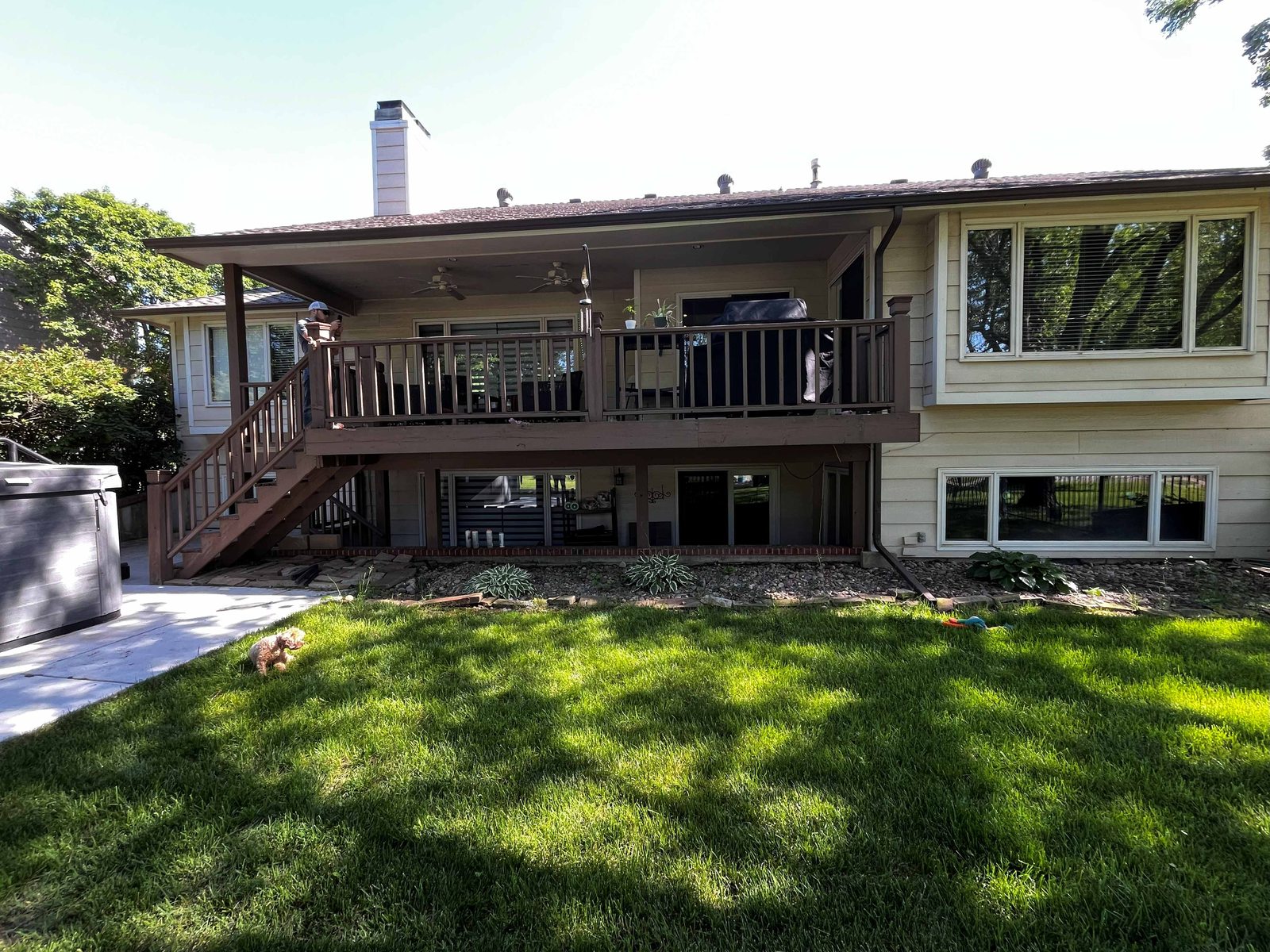 Original stained wood deck and stairs before the rebuild
