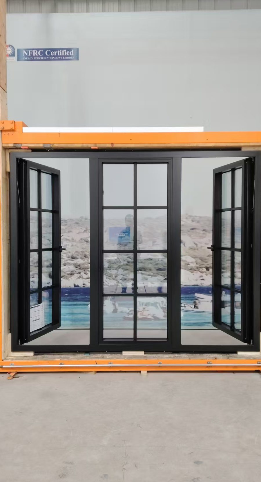 Outward-opening aluminium casement windows shown open